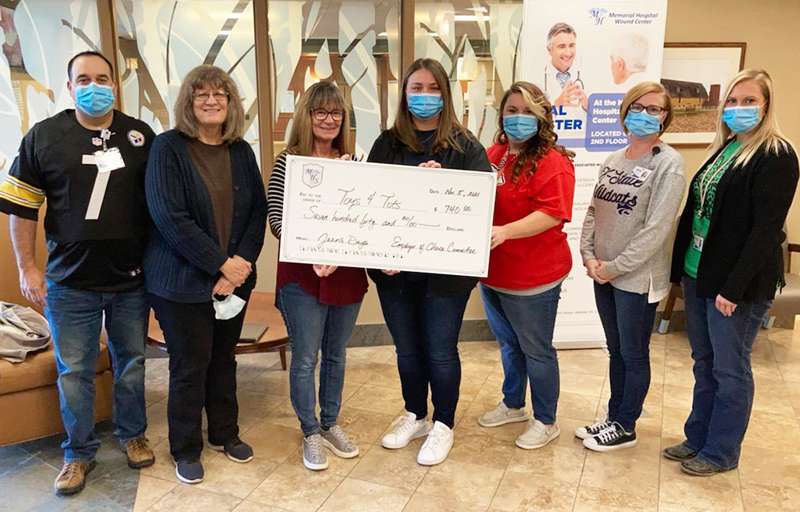 <i><b>From left are: Abilene Area Toys 4 Tots board members Billy Hansen, Theresa Sheaffer, and Linda Creach, along with EOC committee members McKenzie Funston, Cindy Whittington, Haley Jones, and Mallary Knitter.</b> Photo courtesy Memorial Health System</i>