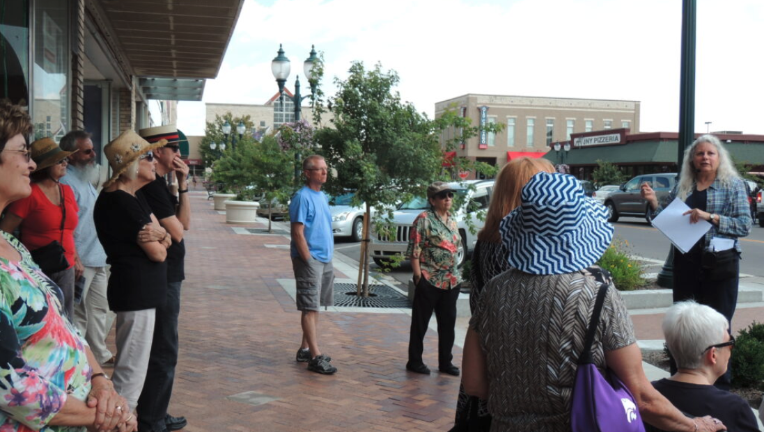 Cheryl Collins, right, leads a walking tour of downtown Manhattan. (Gloria Freeland, courtesy Kansas Reflector)