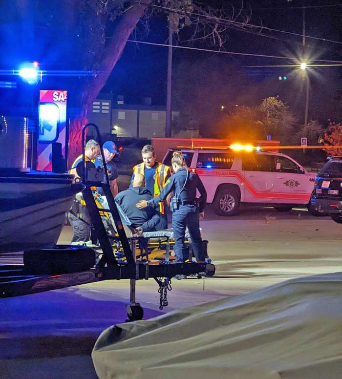 <b>Salina Fire EMS personnel check out a person at the scene of the accident.</b>