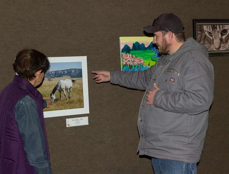 Viewers discuss the After Hours Artists show in Chadron State College's Mari Sandoz High Plains Heritage Center Oct. 22, 2021. (Photo by Molly Langhorst/Chadron State College)