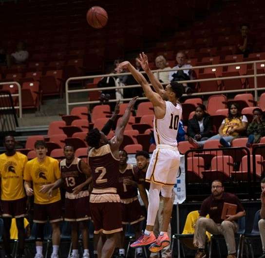 Missouri Western's Q Mays (10) fires for three in the first half of the Griffons' 93-82 win over No. 8 St. Thomas Aquinas at Civic Arena Sunday. Photo by John Roushkolb.