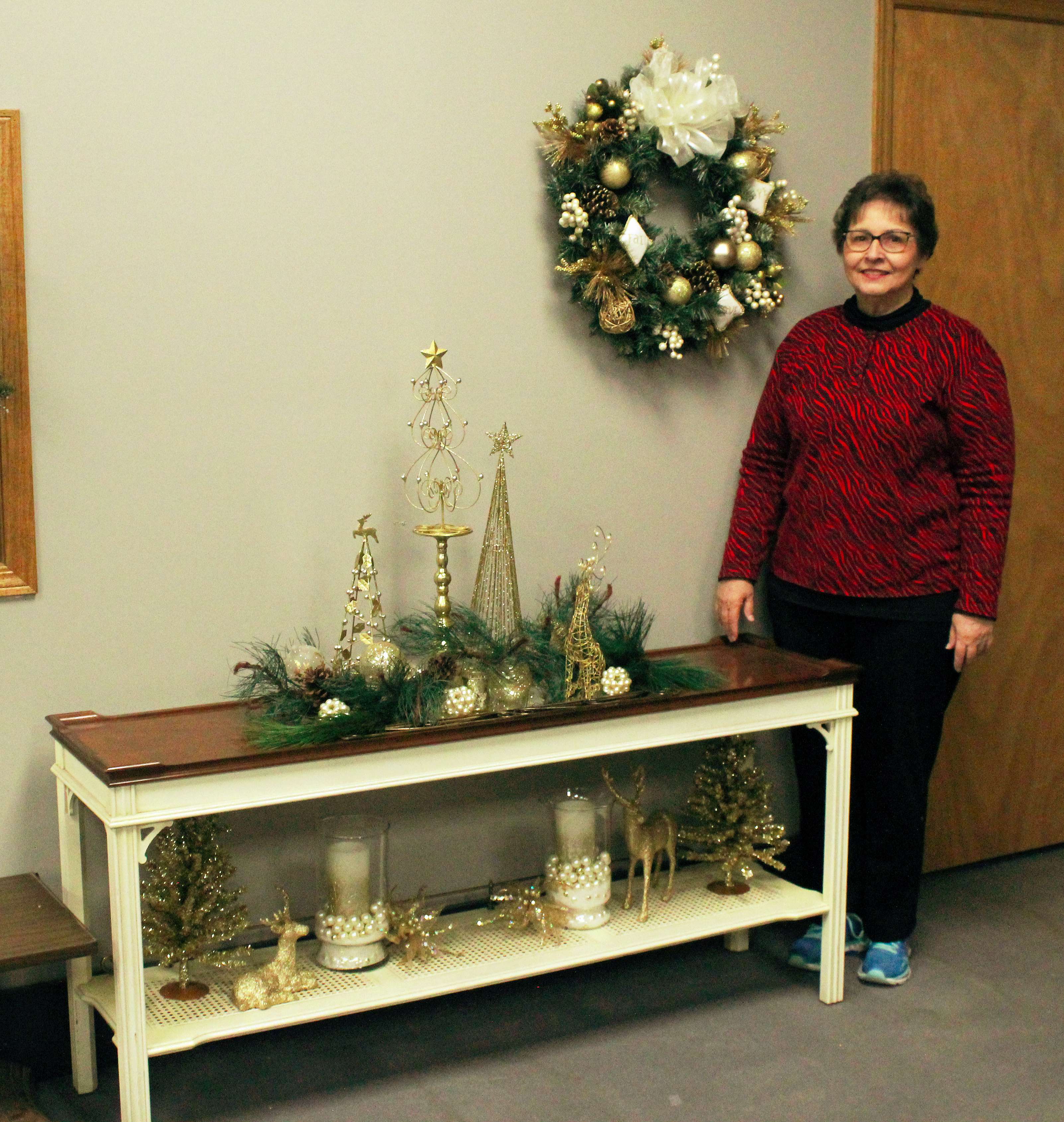 Volunteer Joan Heier with items she made for the Arc Festival of Trees.<br>