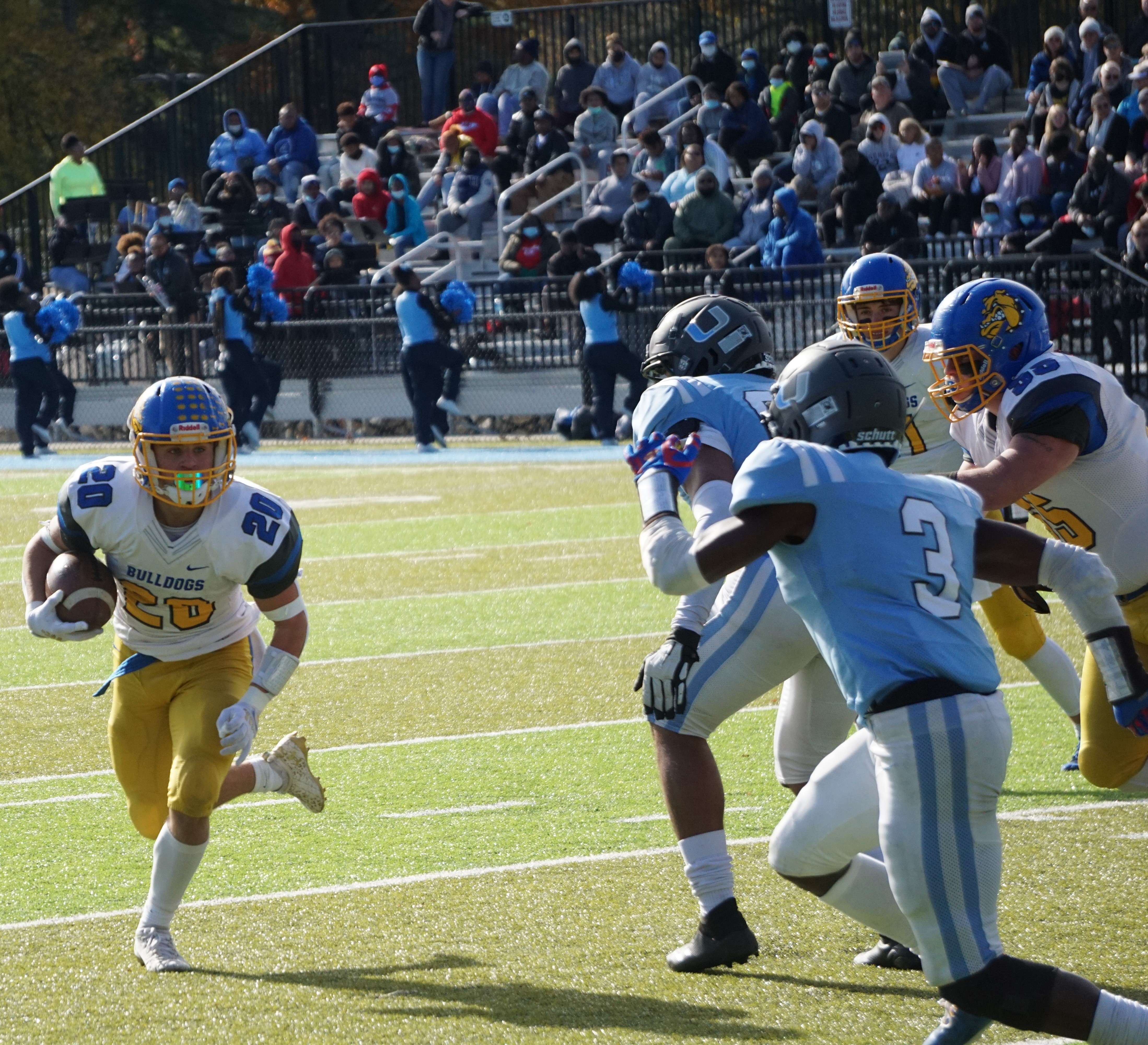 Trevor Klein (20) rushes for a TD in the first half against University Academy Charter. Photo by Matt Pike.