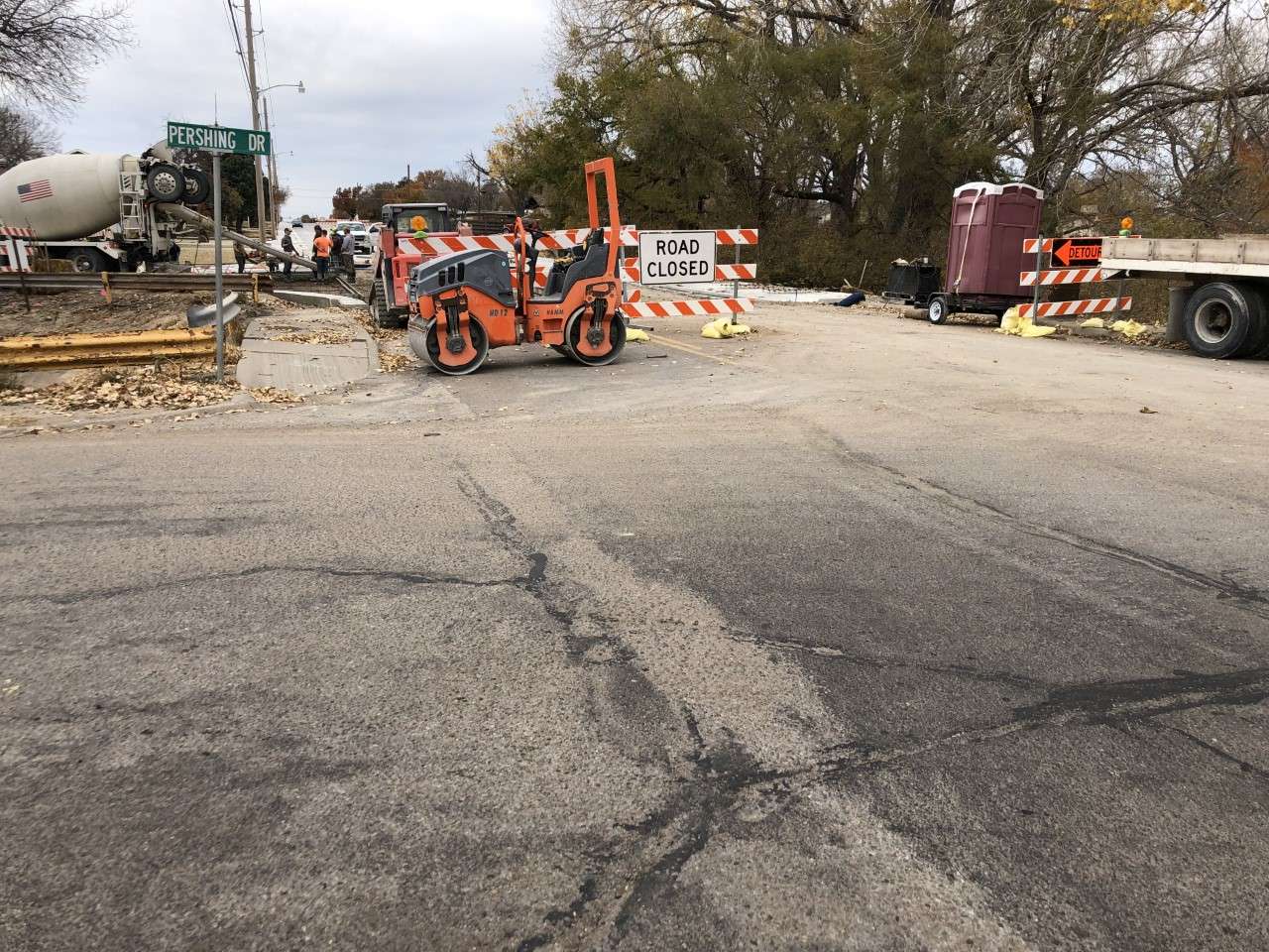 Workers pour cement at 27th and Lincoln Drive Tuesday morning. The detour will open next week as the reconstruction project is temporarily halted during the winter months. (Becky Kiser/Hays Post)