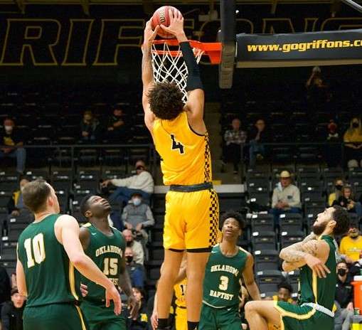 Alex John (4) goes up for a dunk in the second half of Missouri Western's 74-71 win over Oklahoma Baptist on Friday night at the MWSU Fieldhouse. Photo by Kari Ham.