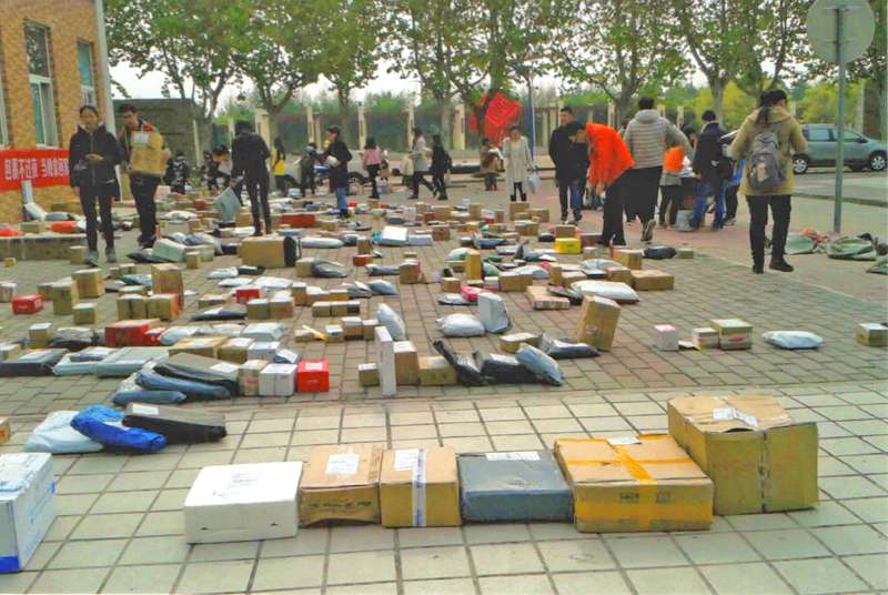 <b>Chinese students looking to pick up their packages. </b>Photo courtesy John Richard Schrock
