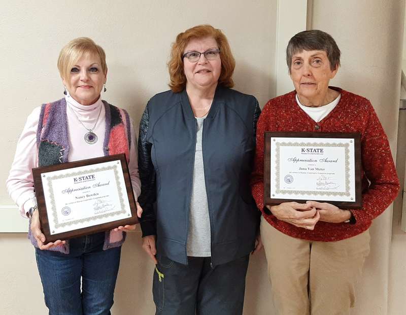 <b>Mary Bernhardt, Central Kansas Extension District governing body chairwoman, center, presents Appreciation Awards to Nancy Bowden of Salina, left, and Jana Van Meter of Ada.</b> Photo courtesy Central Kansas Extension District