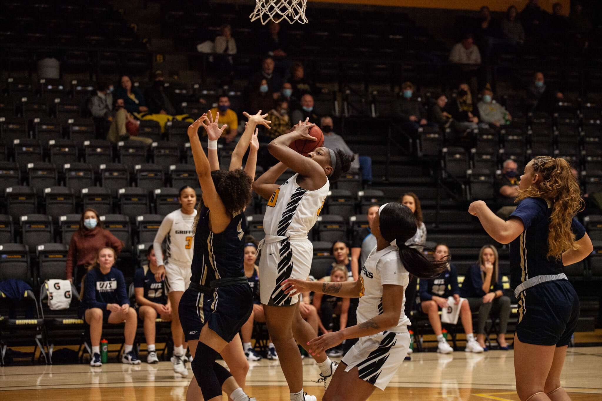 Missouri Western's Corbyn Cunningham (middle) goes up for two in the first half of the Griffons' 82-72 win over Illinois-Springfield on Monday at the MWSU Fieldhouse. Photo by Arianne Boma.