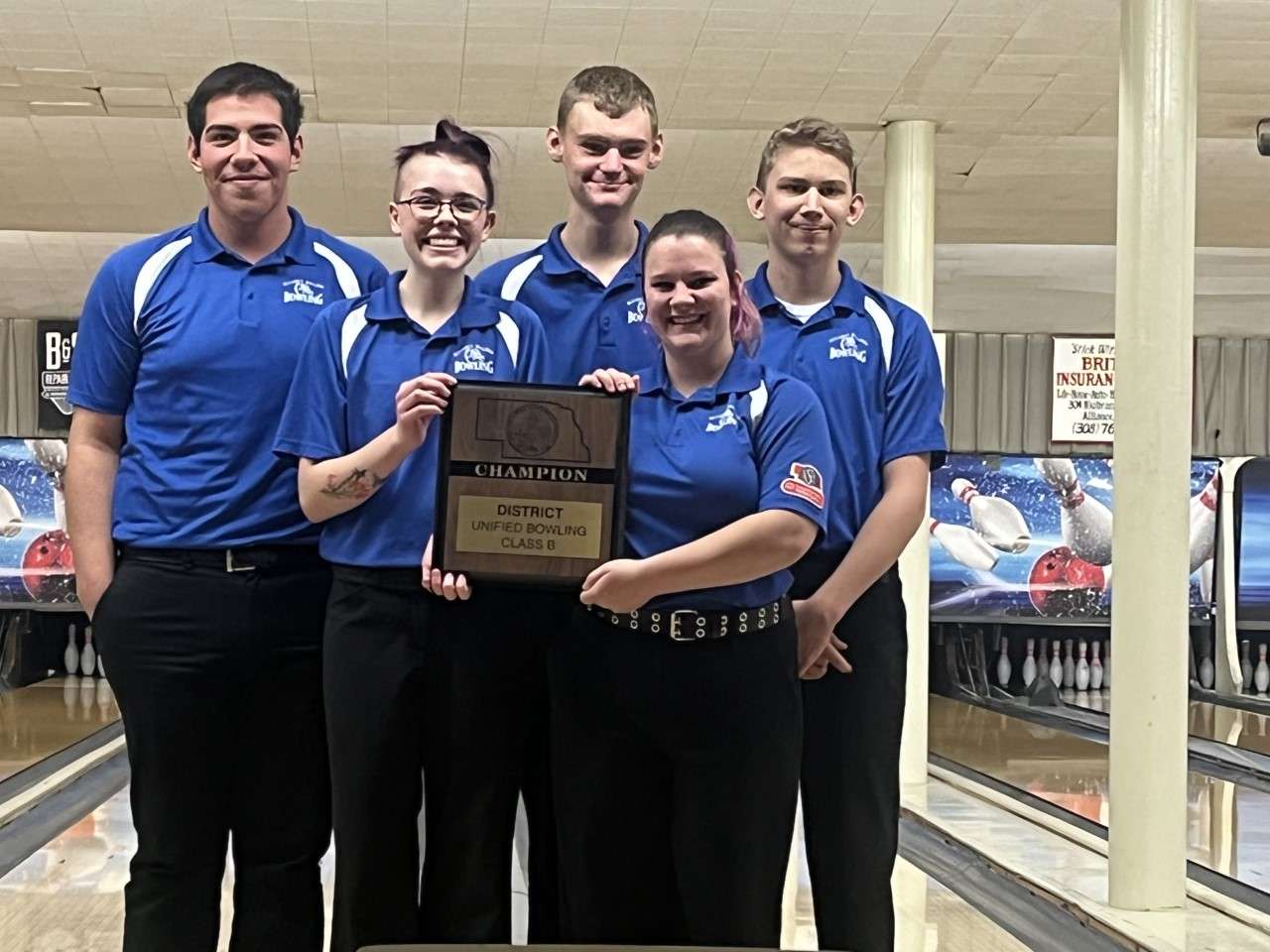 Back L-R: Moises Garza, Tyler Jensen, Daulton Mangas. Front holding plaque L-R: Rhonda Clark, Meagan Morgan
