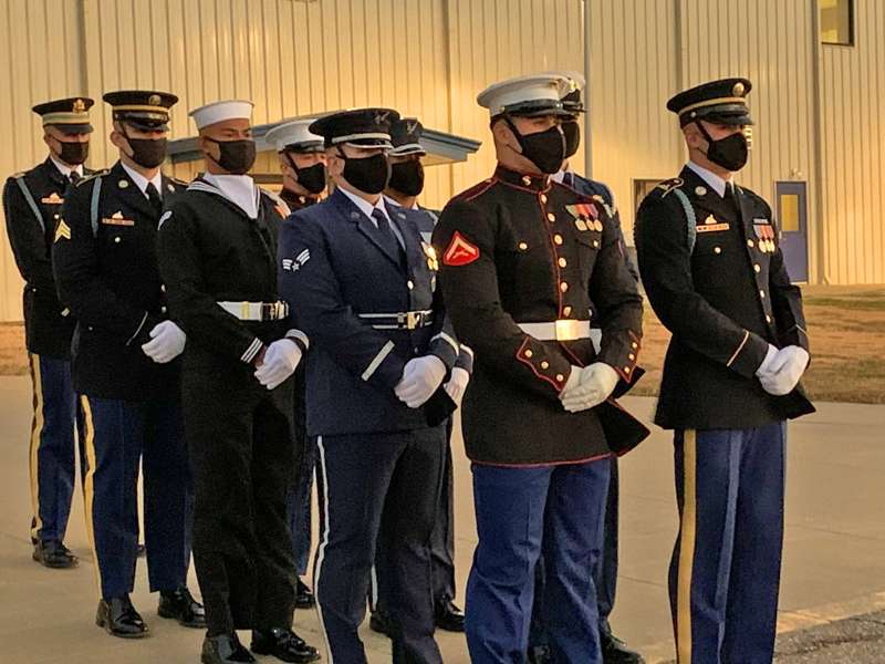 <b>The honor guard awaits the plane's arrival from Washington, D.C.</b>