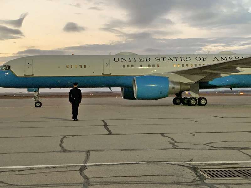 <b>A member of the honor guard stands at attention as the plane comes to a stop.</b>