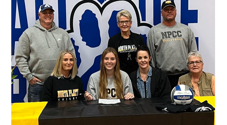 <i>Avah Steggall, of Alliance, is surrounded by family as she signs a letter of intent to play for the North Platte Community College Knights Volleyball Team.</i>