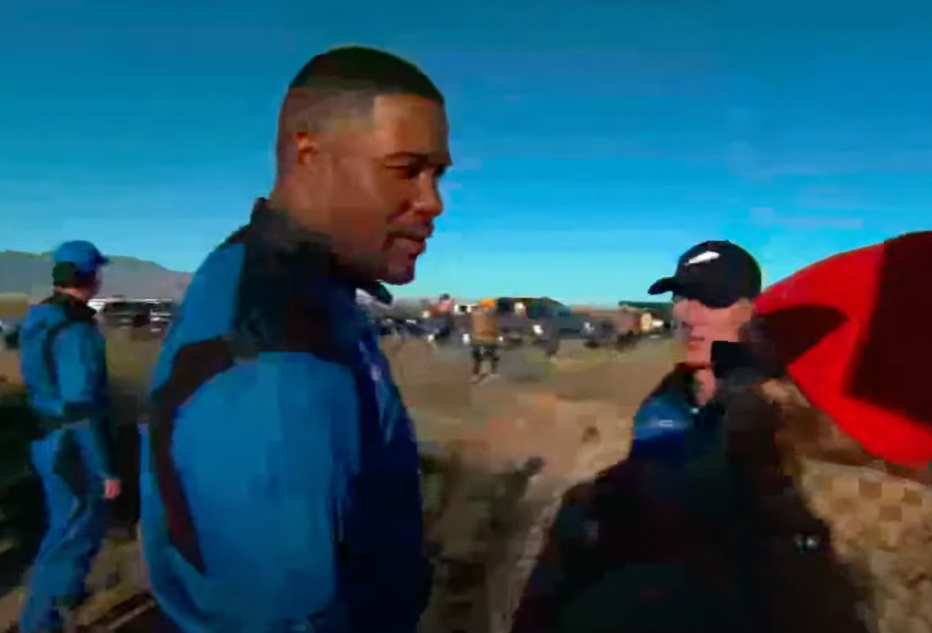 Michael Strahan visits with Jeff Bezos after the successful launch and return to earth-photo courtesy Blue Origin