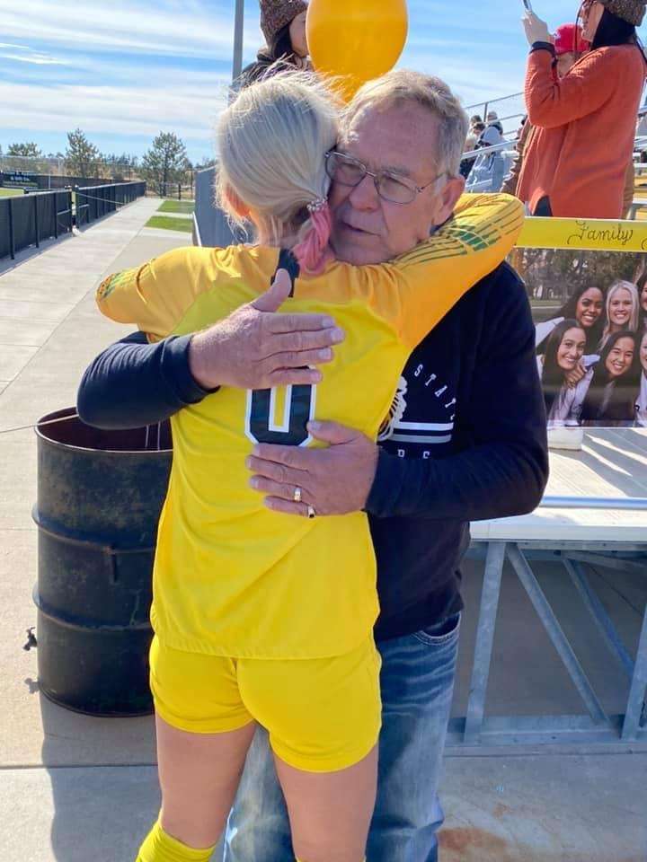 Wellbrock hugs her father on senior day. FHSU University Relations