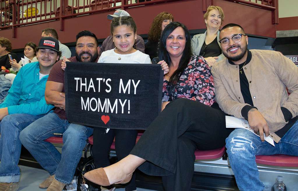 Chadron State College Winter Commencement Dec. 17, 2021, in the Chicoine Center. The family of graduate Rudi Palomo of Scottsbluff, Neb., celebrates. From left, Marion Salazar, brother, Abel Salazar, father, Nevaeh Salazar, daughter, Shontrice Salazar, mother, and Joses Palomo, husband. (Photo by Tena L. Cook/Chadron State College)