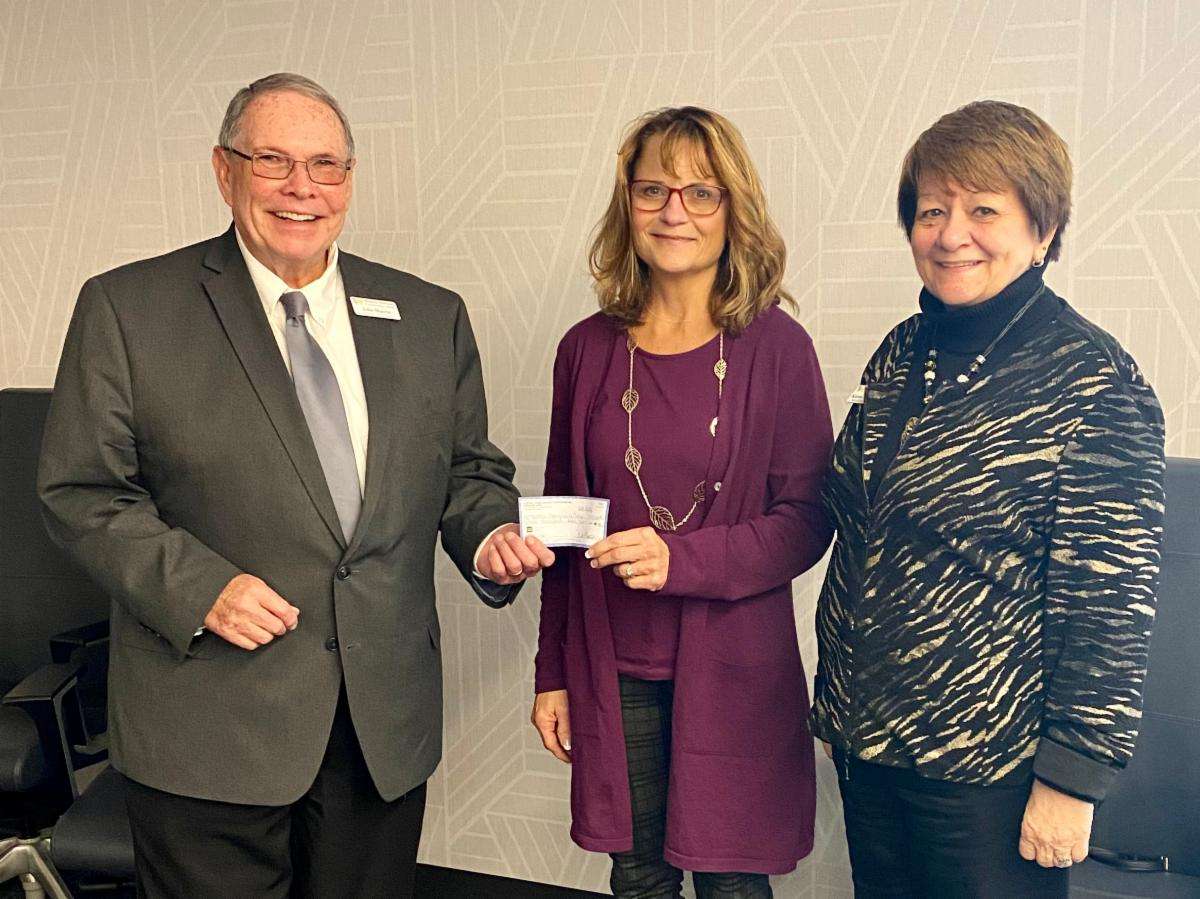 Melody Baily (middle), NPPD Retail Account Manager presents a check for $15,000 to WNCC Interim President John Marrin, and WCCA Board Vice Chair Karen Anderson at November's WCCA Board of Governors meeting.
