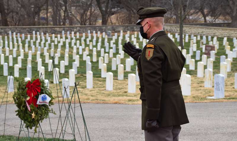 <b>Fort Riley's Major General D. A. Sims salutes during a Wreaths Across America ceremony.</b> Photos courtesy Fort Riley