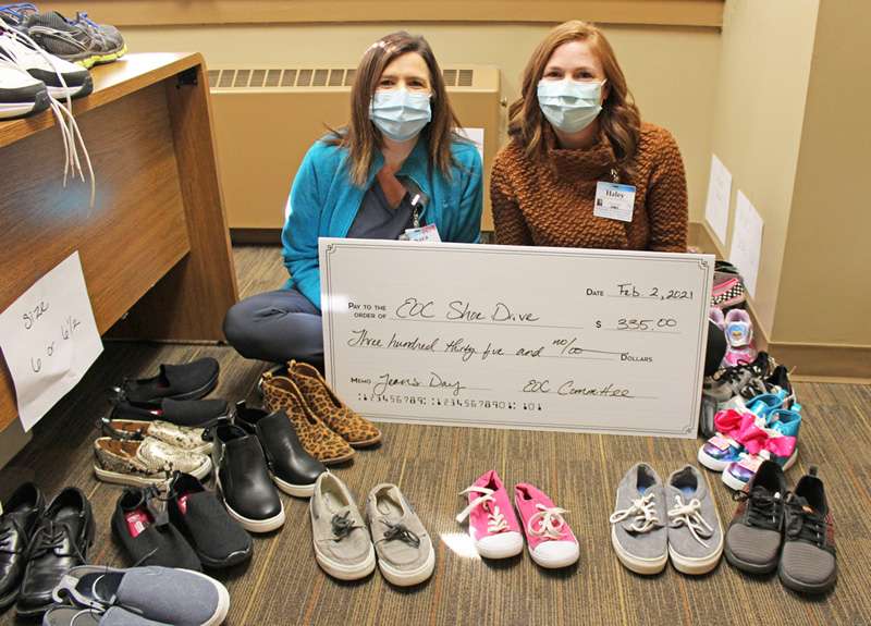 <i><b>Pictured, with some of the donated shoes, are EOC committee members Sara Boyd (left) and Haley Jones.</b> Photo courtesy MHS</i>