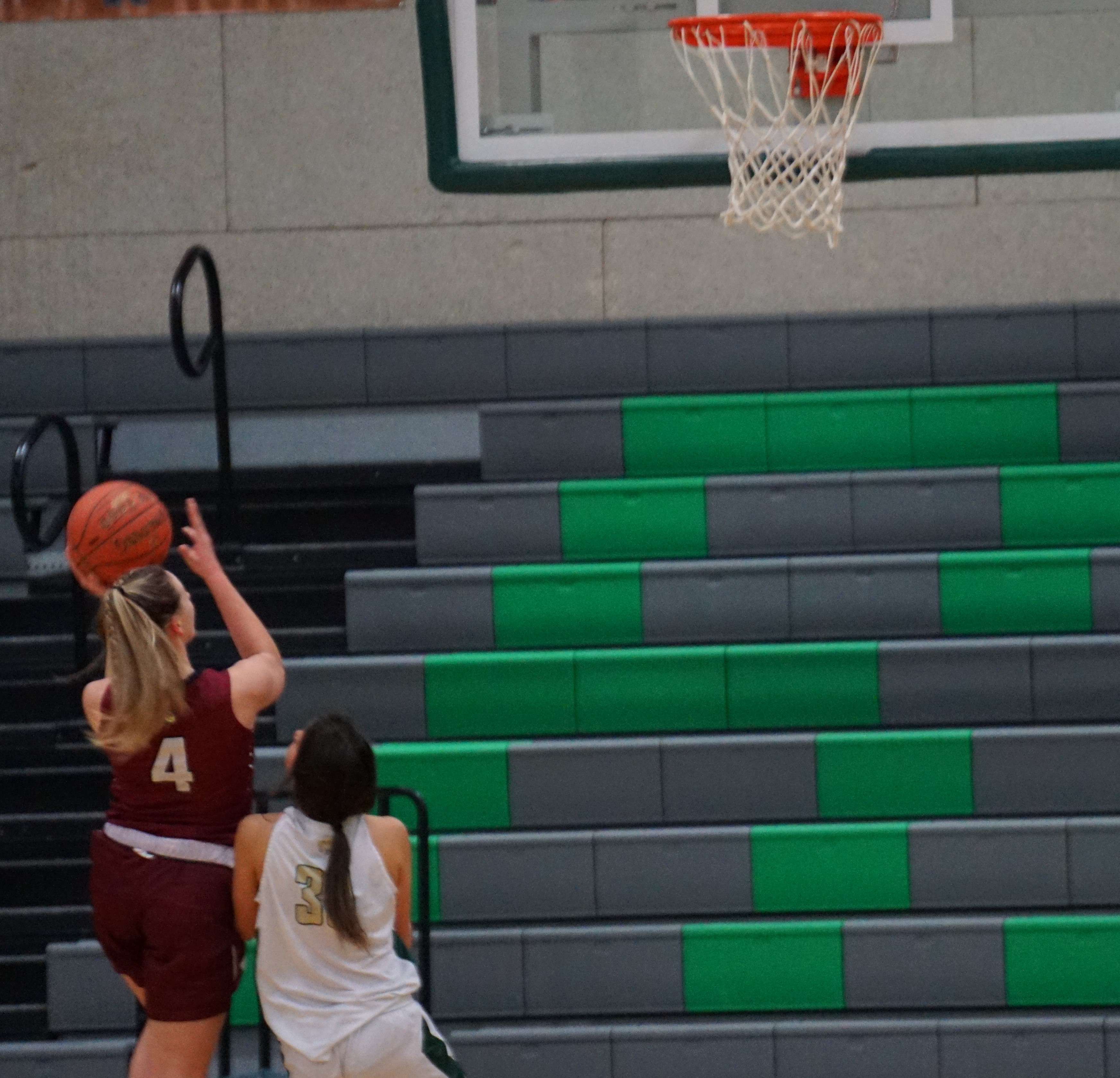 Jaida Cox (4) goes up for two in the second half of Benton's 50-27 win over Lafayette Tuesday. Photo by Tommy Rezac.