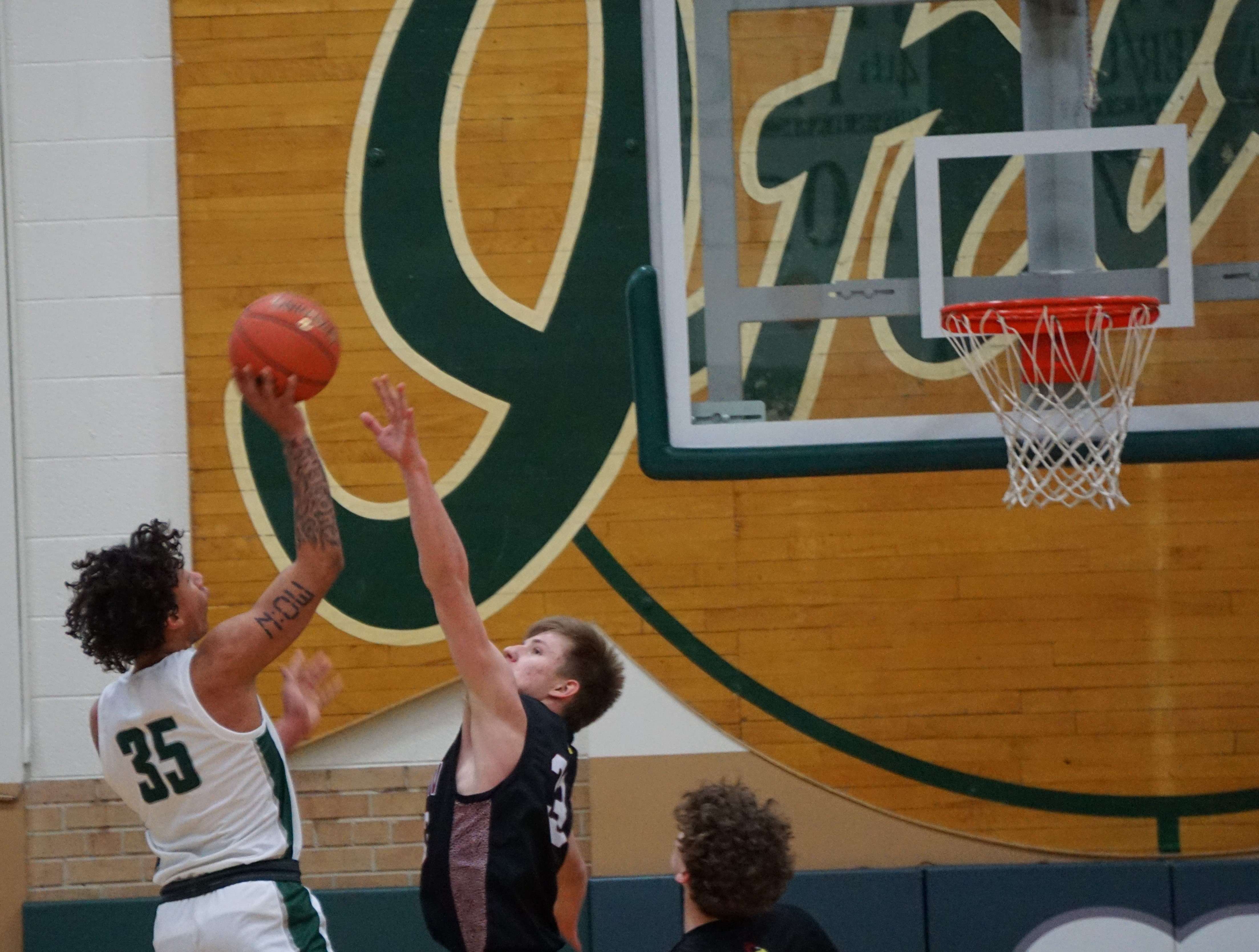 Camden Bennett (35) puts a jump shot in Lafayette's 63-33 win over Benton Tuesday. Photo by Tommy Rezac.