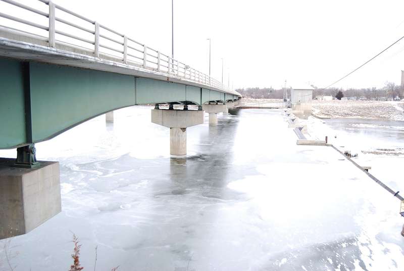 <b>Kansas Interfaith Action highlighted the record of Black lynchings in the state Friday to emphasize the need to understand history and work against racial terrorism in the future. In 1882, three Black men were hanged by vigilantes from a Lawrence bridge since replaced by this modern crossing over the Kansas River. </b>(Tim Carpenter/Kansas Reflector)