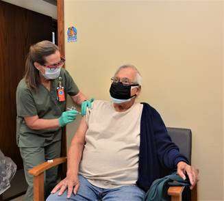 <b>Veteran Raymond Hernandez gets his first dose of the COVID-19 vaccine from Beverly Novak, RN, in Salina</b>. Photos courtesy the Robert J. Dole VA Medical Center Public Affairs Office