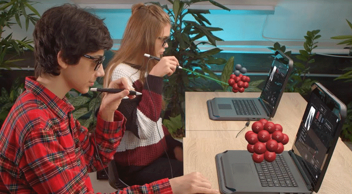 <i>Students add protons and neutrons to an atom nucleus using zSpace technology. Mid-Plains Community College will soon be using the same technology in its classrooms.</i>