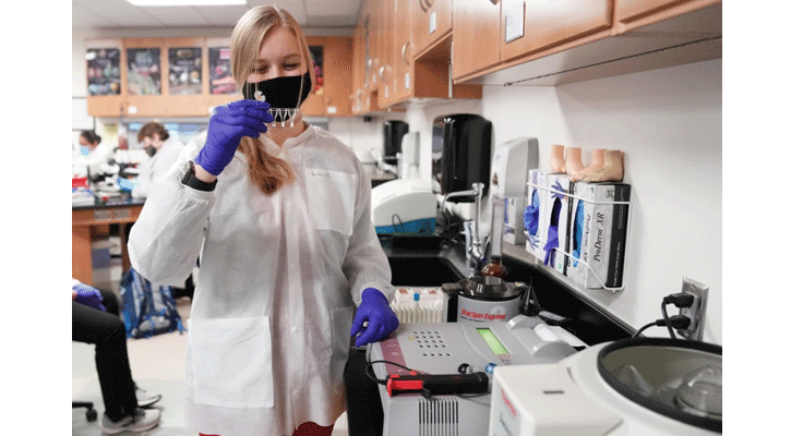 <i>North Platte Community College </i><i>medical laboratory technician student Keshia Leeper, of Madrid, looks for clots Monday following the use of a new Diagnostica Stago STart® 4 Hemostasis Analyzer. (Courtesy Photo)</i>