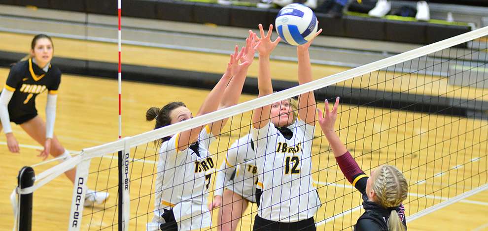 <b>Jaycee Burghart (left) and Lizzy Pfortmiller (right) team up for a block against Hesston.</b> Photo courtesy <a href="http://cloudtbirds.com">cloudtbirds.com</a>