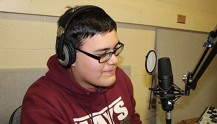A former HHS radio student in the school's old studio. File photo