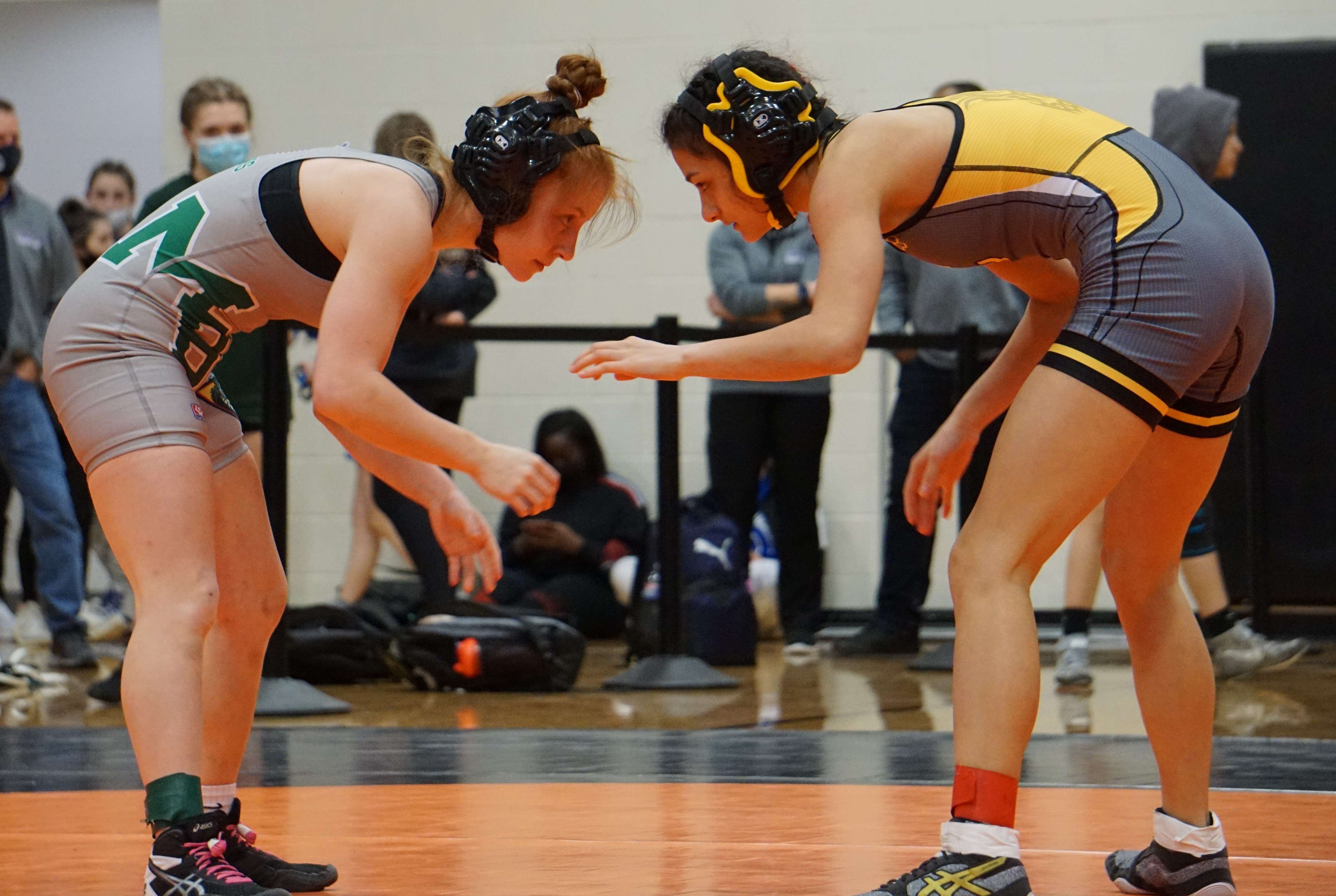 Cameron's Ashley Yamat (right) squares up against Mid-Buchanan's Loren' Patee in the third place match of the 102 pound weight class in Saturday's Class 1 Section 4 wrestling meet at Platte County High School Saturday. Yamat has advanced to state. Photo by Tommy Rezac.