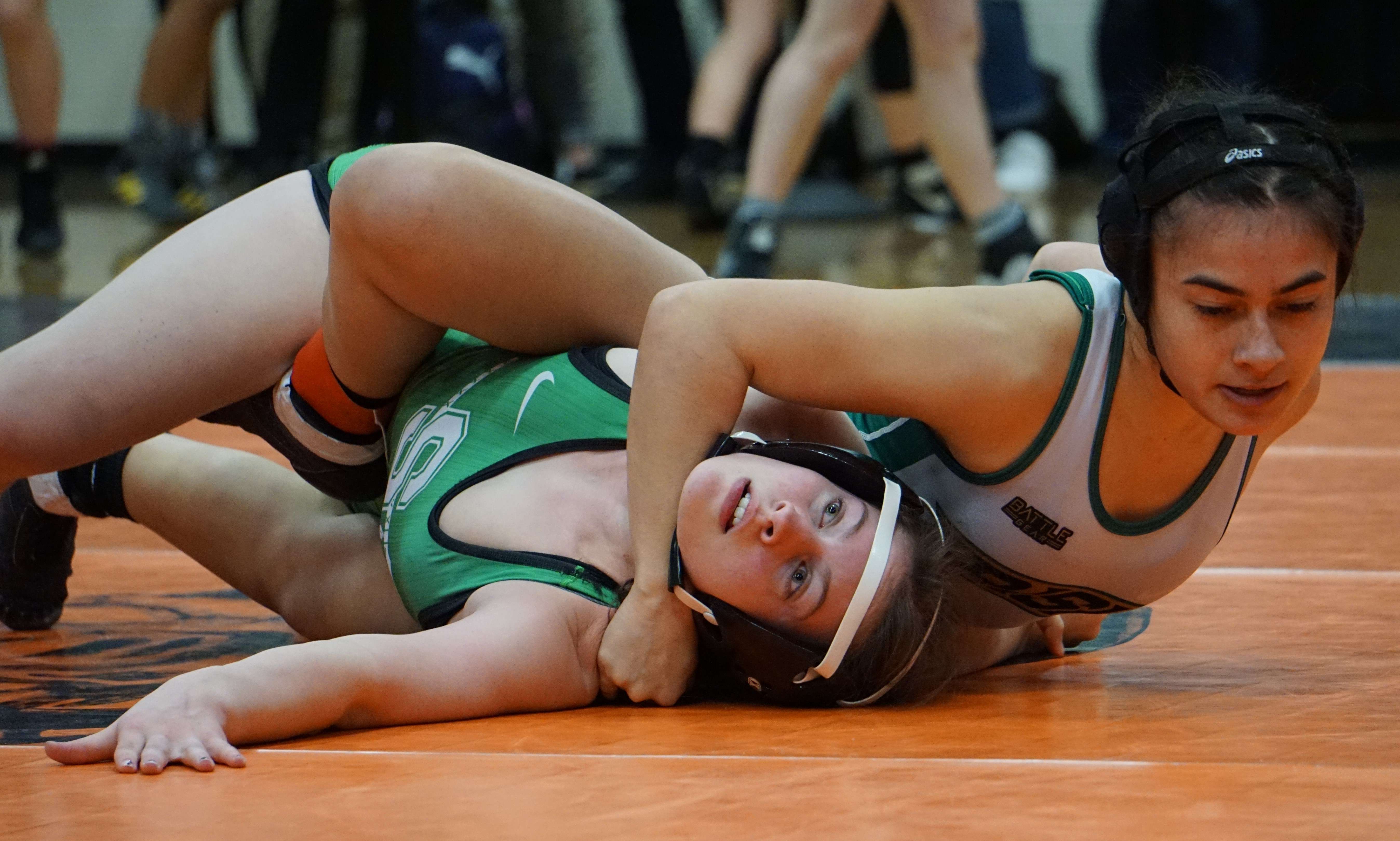 Lafayette's Isa'Bella Mendoza (right) works to pin Ruby Scarborough of Smithville in the third place match of the 107-pound bracket at Saturday's Class 1 Section 4 girls' wrestling meet at Platte County High School. Photo by Tommy Rezac.