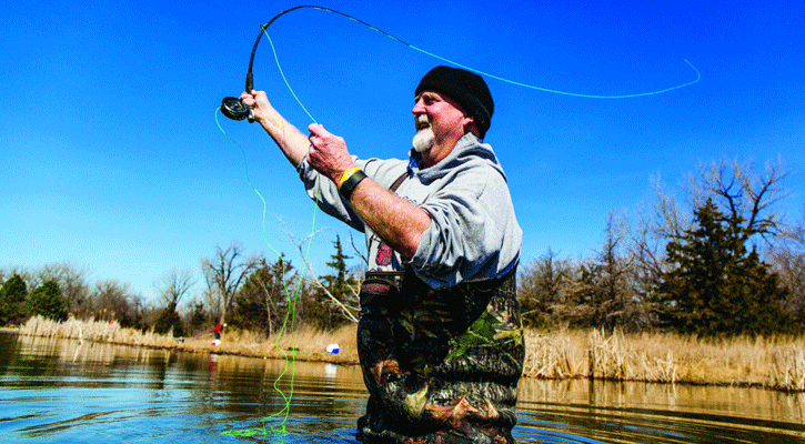 Dennis Ahl of Fairbury fly fishes the trout lake at Two Rivers State Recreation Area in Douglas County on a March day in 2017. (Nebraskaland Magazine/NGPC)