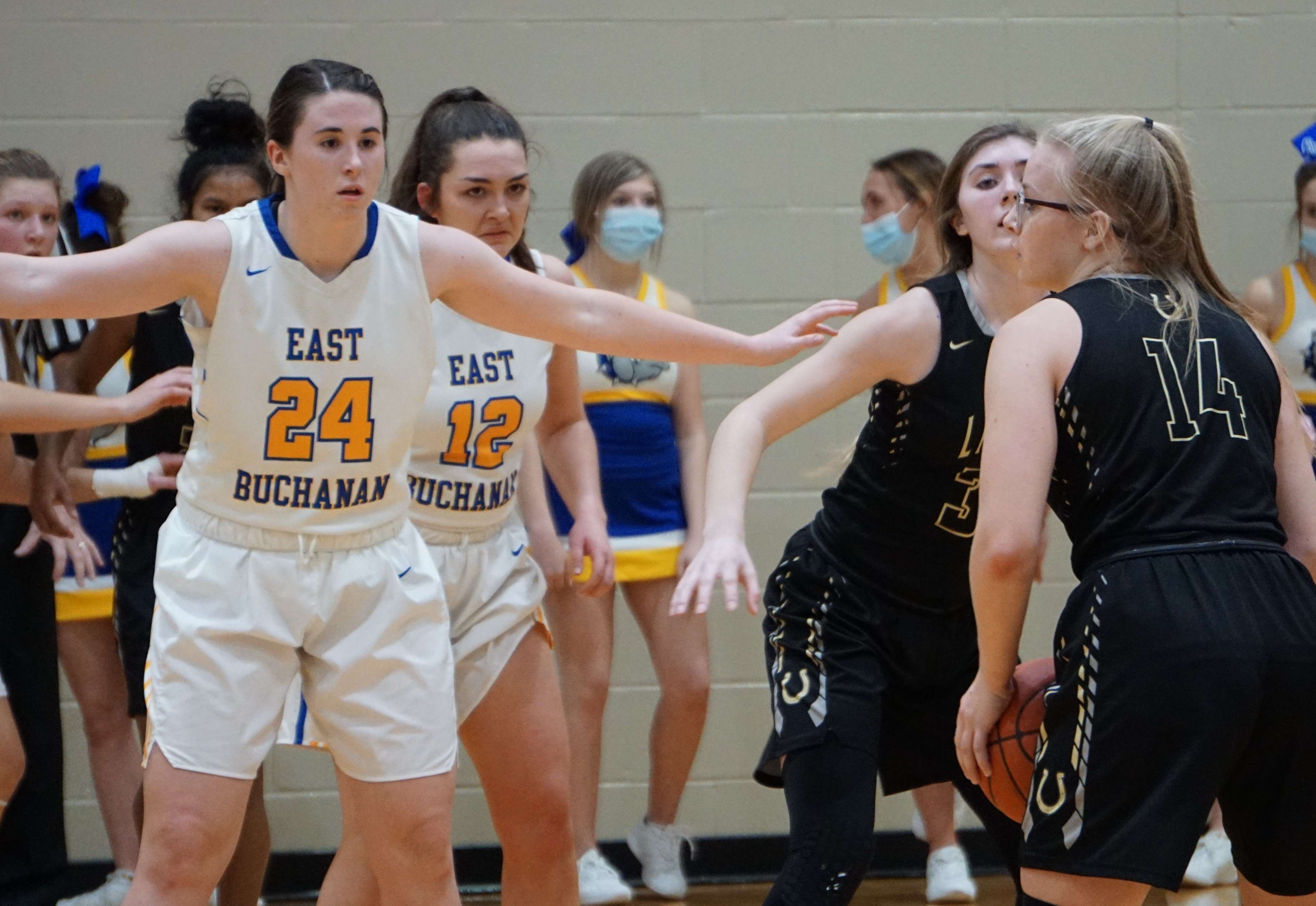 East Buchanan's Lilly Schilling (24) defends against Lathrop's Josie Wright in the second half of the Bulldogs' 40-26 win over the Mules in Tuesday's district semifinal. Photo by Tommy Rezac.