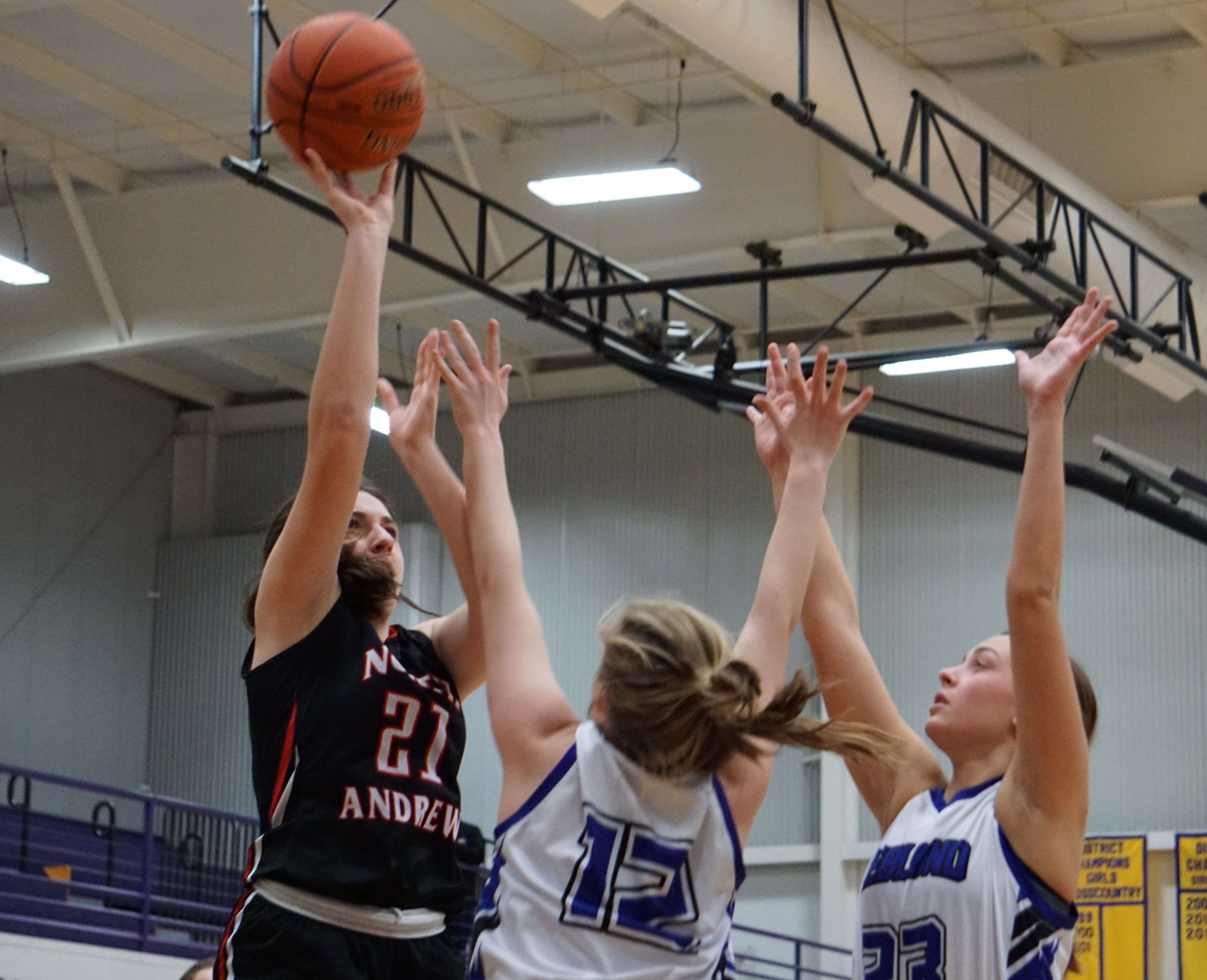 North Andrew' Riley Walker (21) goes for a layup in the second half of North Andrew's 51-37 loss to Bishop LeBlond in the Class 2 District 16 semifinal Wednesday. Photo by Tommy Rezac.