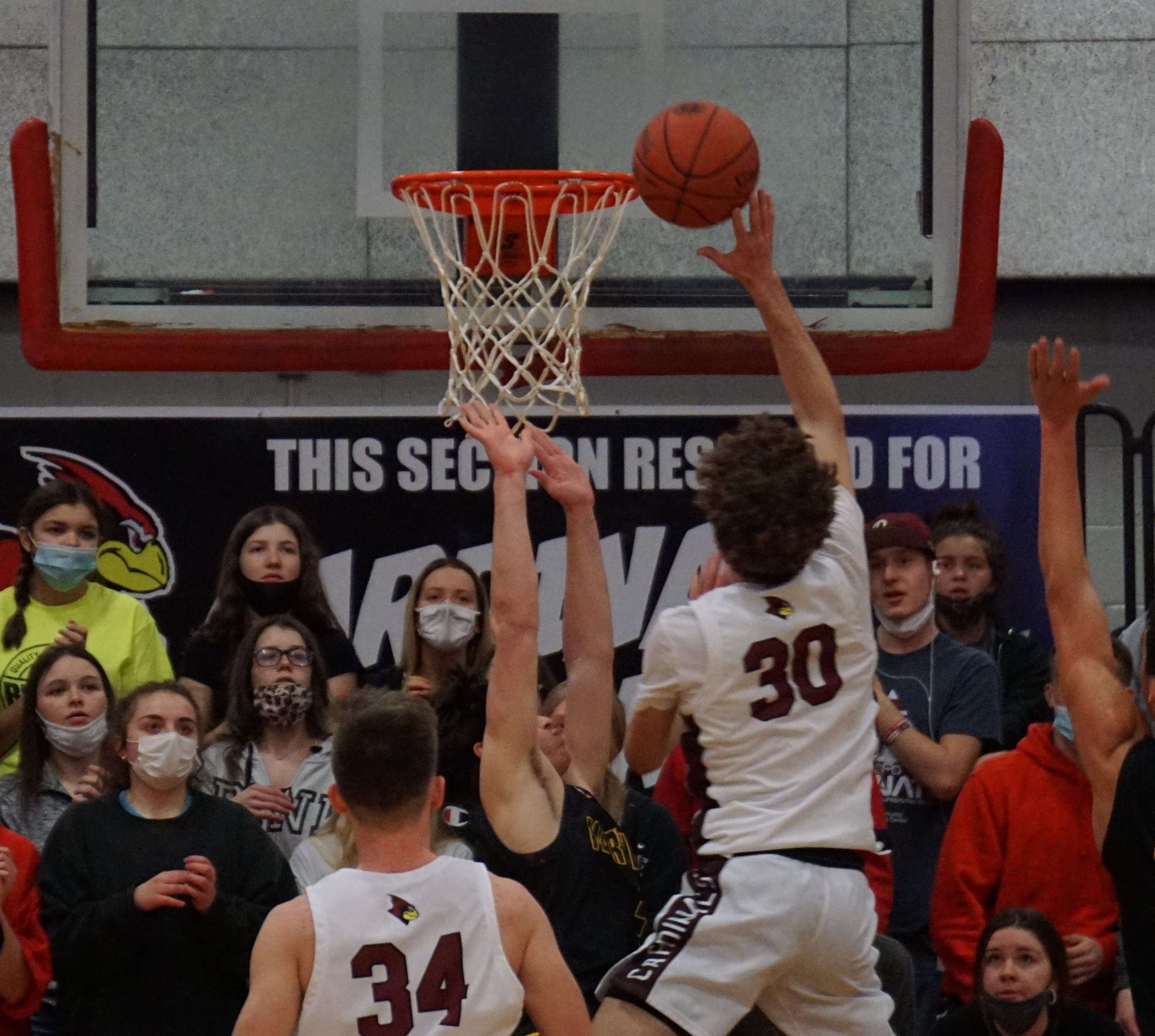 Benton's Kason Mauzey (30) goes in for a late layup in the second half of the Cardinals' 53-48 win over Maryville in the Class 4 District 16 semifinal. Photo by Tommy Rezac.