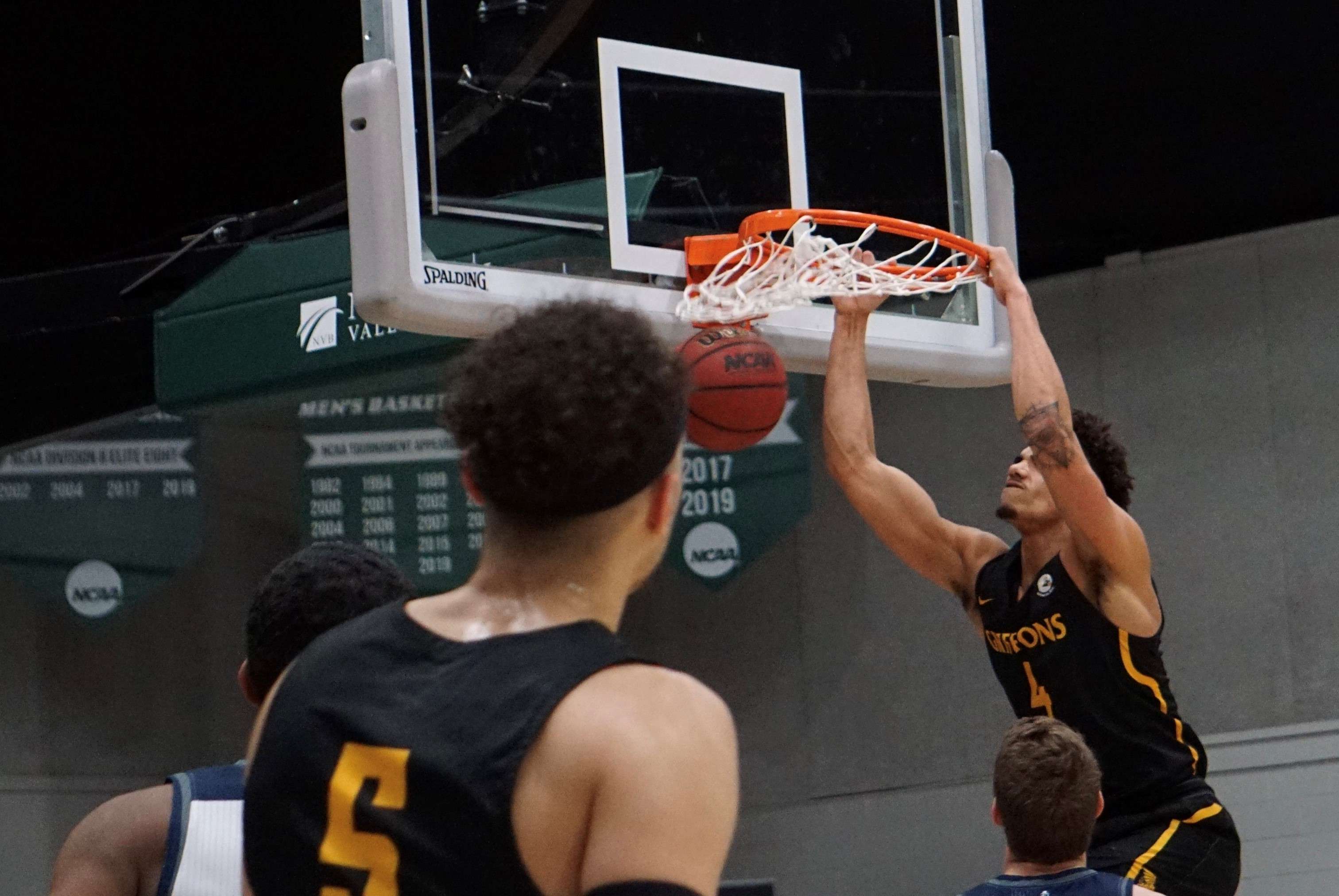 Missouri Western's Alex John (4) throws down a dunk in the second half of the Griffons' 101-72 to loss to Washburn on Friday in the MIAA semifinals. Missouri Western qualified for the NCAA tournament as the No. 6 seed in the Central Region. Photo by Tommy Rezac.