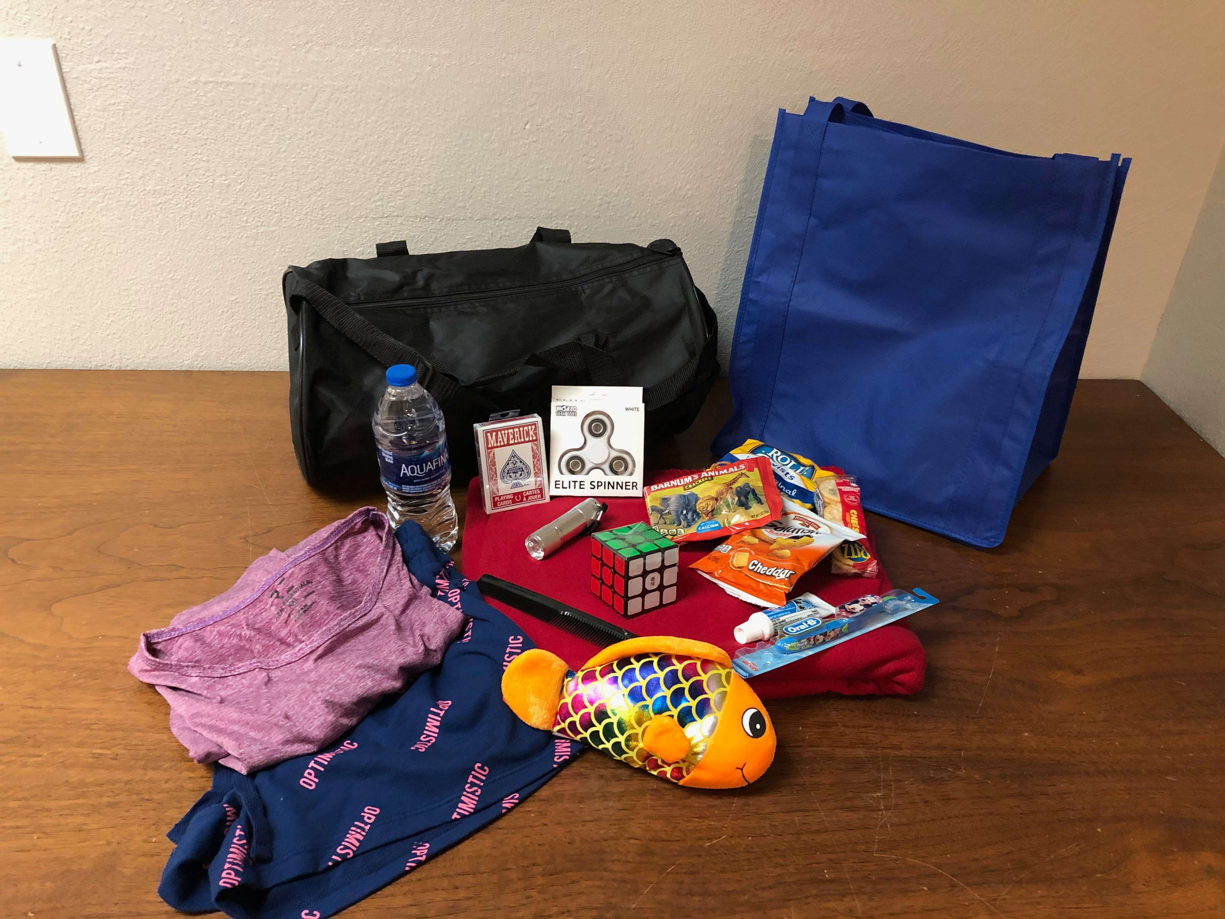 Items from one of the Project Suitcase duffle bags. The bags are given to children in Ellis County that are removed from their homes for abuse or neglect.