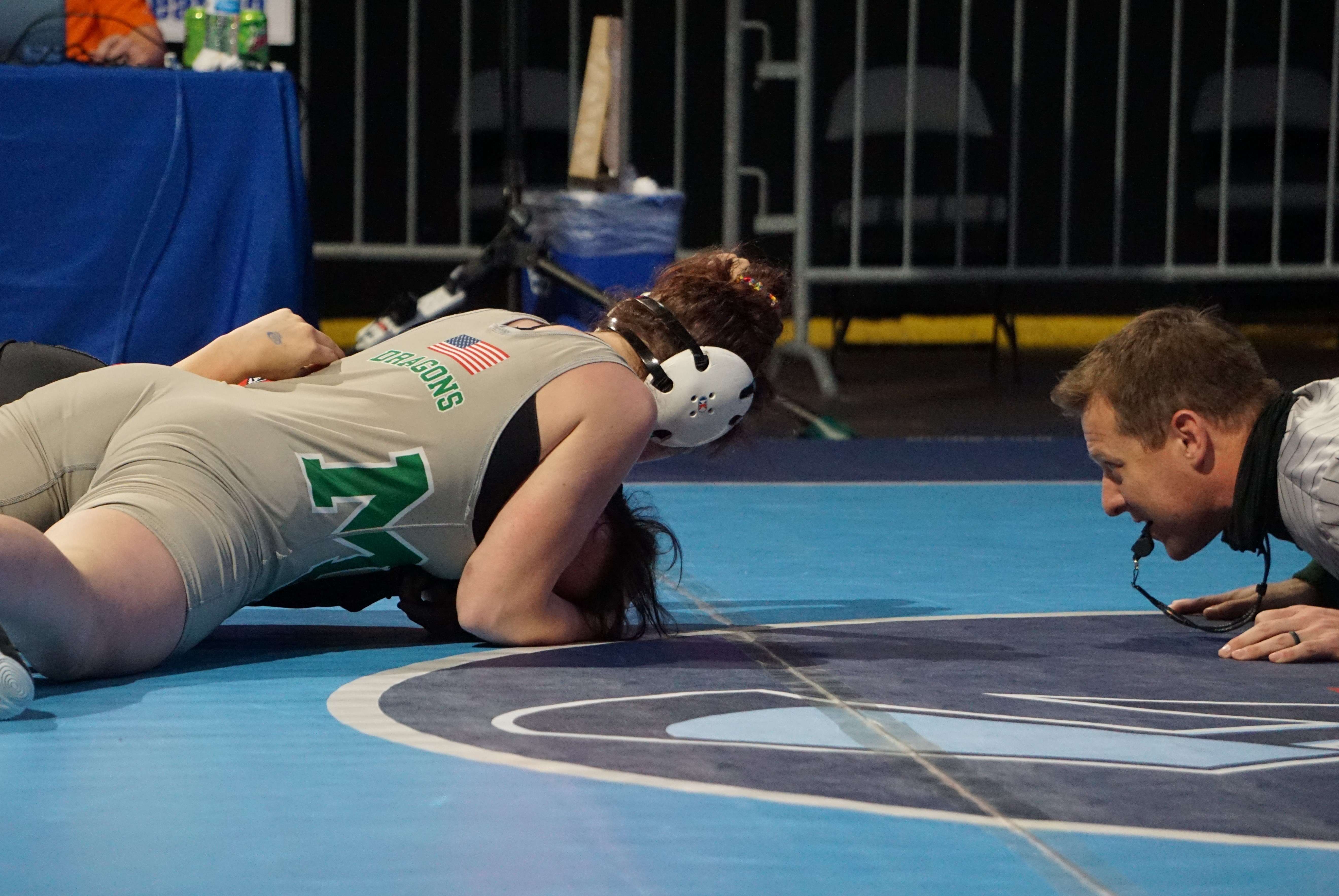 Mid-Buchanan's Layson Hafley secures a pin against Julianna Rivera of Dexter late in the second period of the 5th place medal match at girls' state wrestling in Independence. Photo by Tommy Rezac.