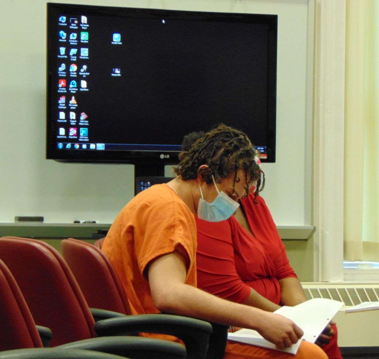Marcain Kimbrough-Ballard goes over paperwork with his attorney prior to the sentencing hearing in Buchanan County./Photo by Brent Martin