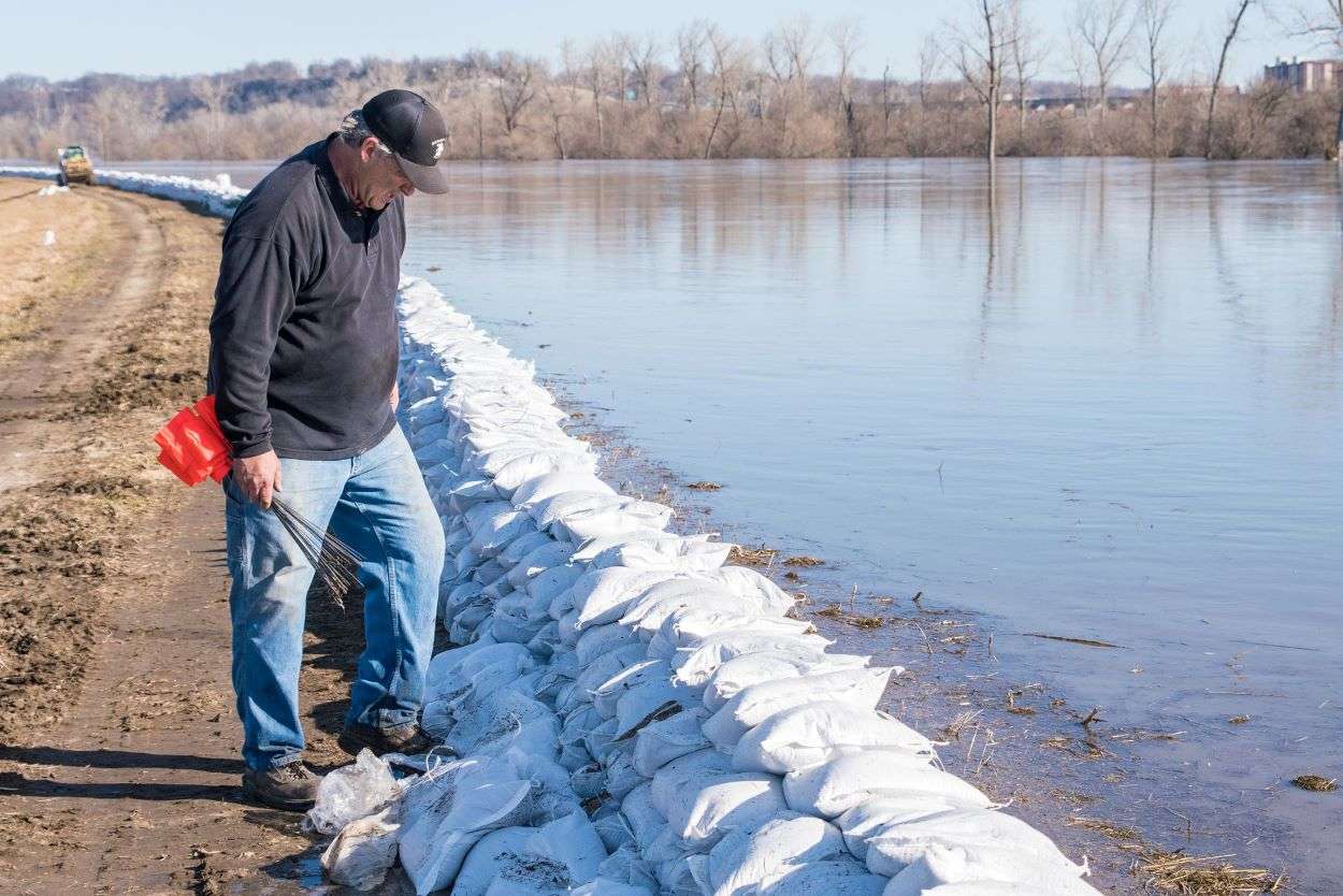 Sandbagging on the Elwood, Kansas side of the Missouri River saved Elwood and Rosecrans Memorial Airport./Photo courtesy of the Air National Guard