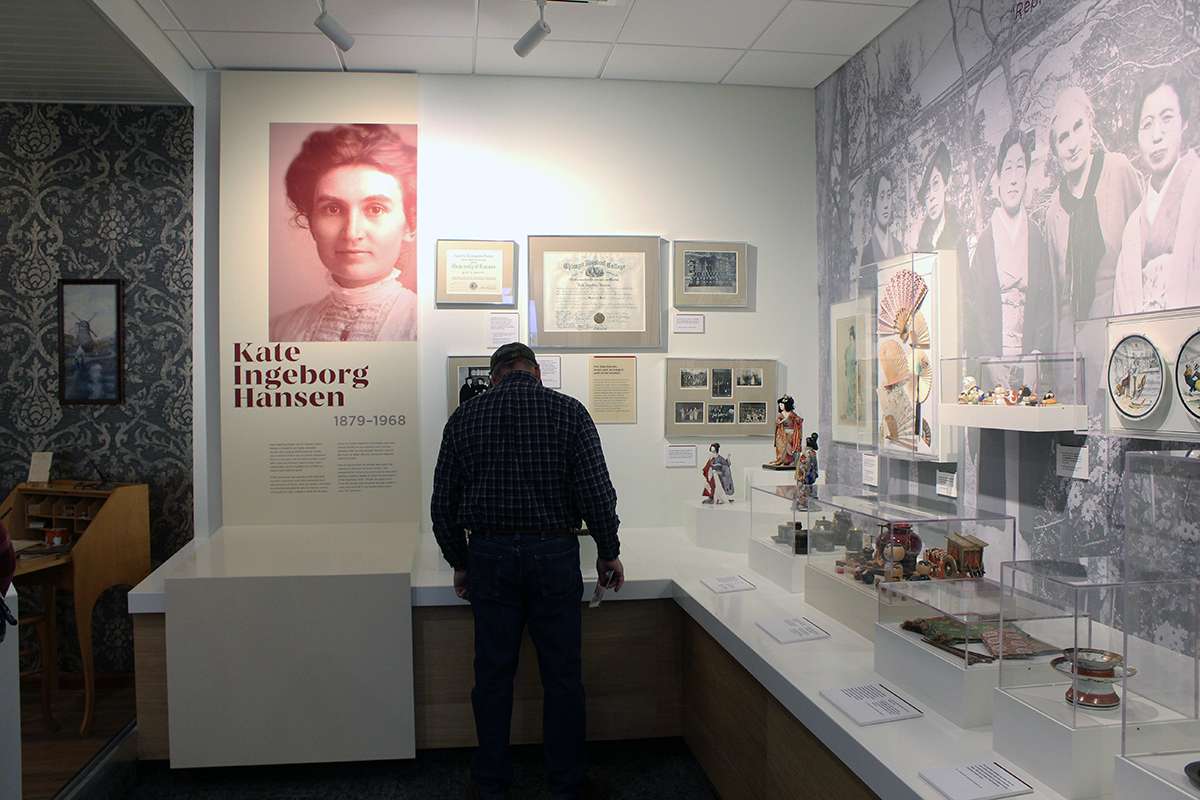 A visitor to the Hansen Museum views artifacts from Dane G. Hansen's sister, Kate Hansen, who was a missionary to Japan.&nbsp;