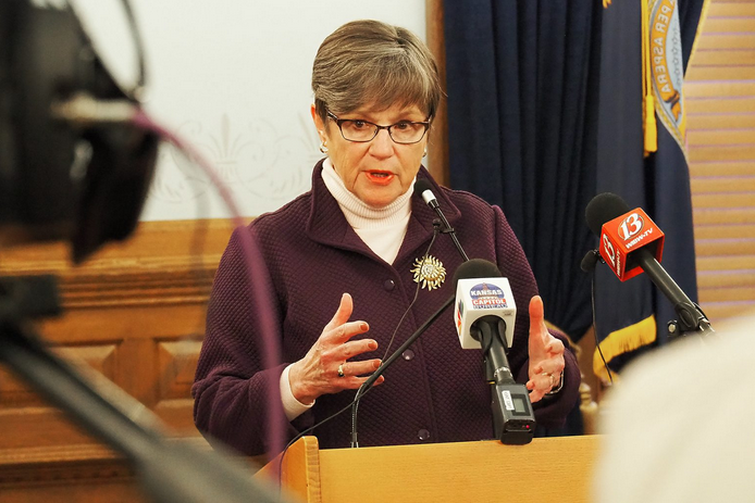 Gov. Laura Kelly signed Senate Bill 40 that broadened the Legislature's oversight powers during the COVID-19 pandemic and indicated she would re-issue a dozen executive orders April 1, including guidance on wearing masks. (Sherman Smith/Kansas Reflector)