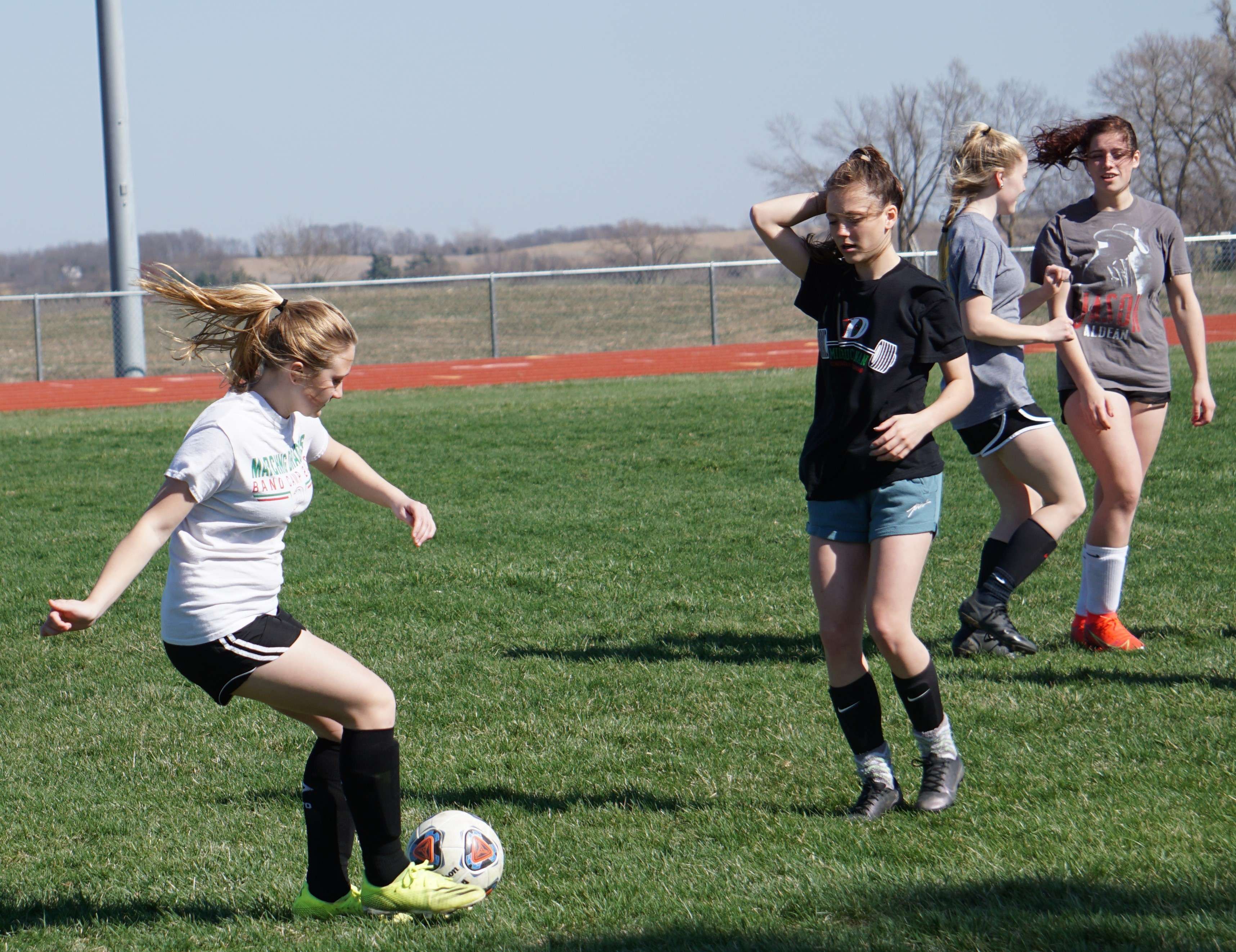 Members of the Mid-Buchanan girls' soccer team go through drills at Monday's practice. The Dragons face East Kansas City at home on Tuesday at 5 pm./ Photo by Tommy Rezac.