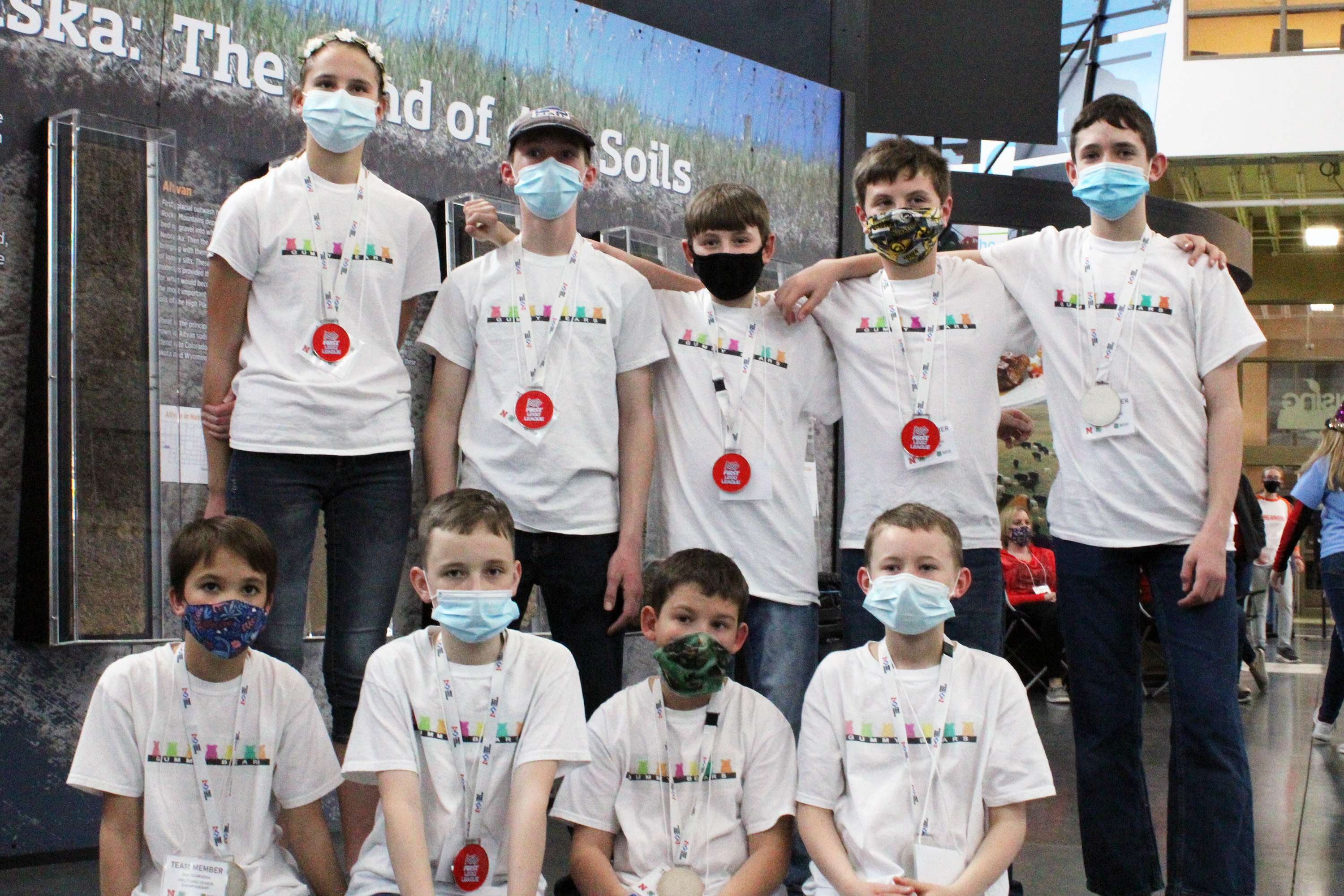 The Rise of the Gummies team at the state competition in Grand Island. Front row, left to right: Lee Rogers, James Downer, Jared Turnidge, and Hunter Creech. Back row, left to right: Capria Rogers, Wyatt Leggott, Noah Rugroden, Hudson DeVos, and Landen Heine.