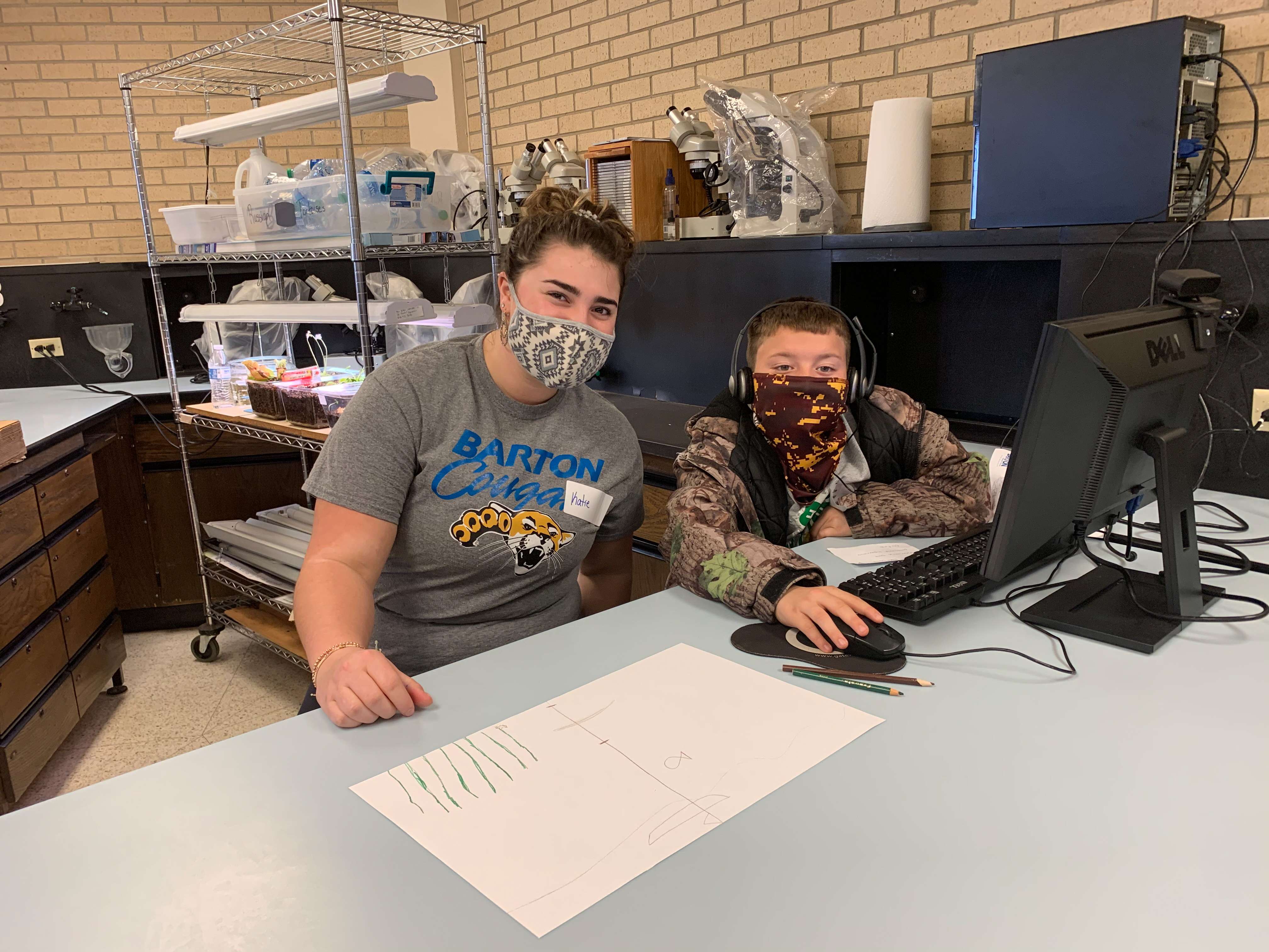 &nbsp; A Barton STEM Club member helps a participant at Space Day March 20 on the Barton Campus<b>.</b>