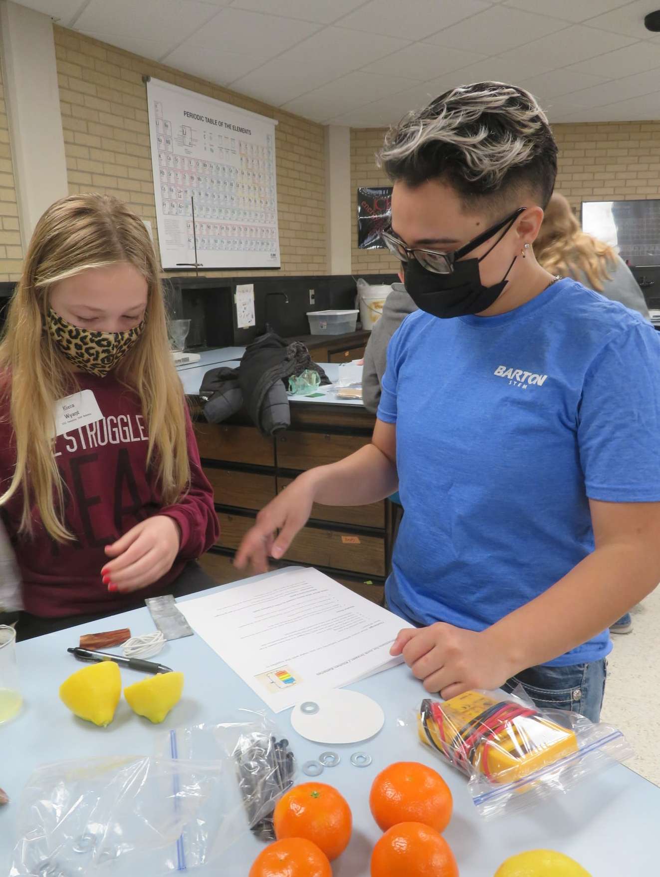 &nbsp; A Barton STEM Club member explains an activity to a participant at Space Day, which was held March 20 on the Barton campus<b>.</b>