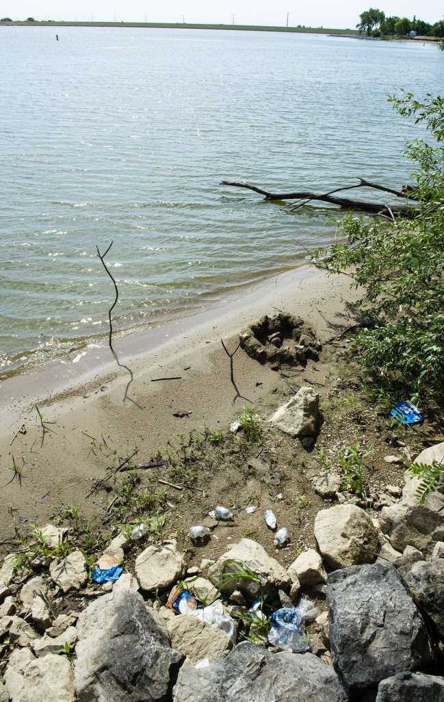 Litter is left along the shoreline at Pawnee State Recreation Area in Lancaster County. (Nebraskaland Magazine/NGPC)