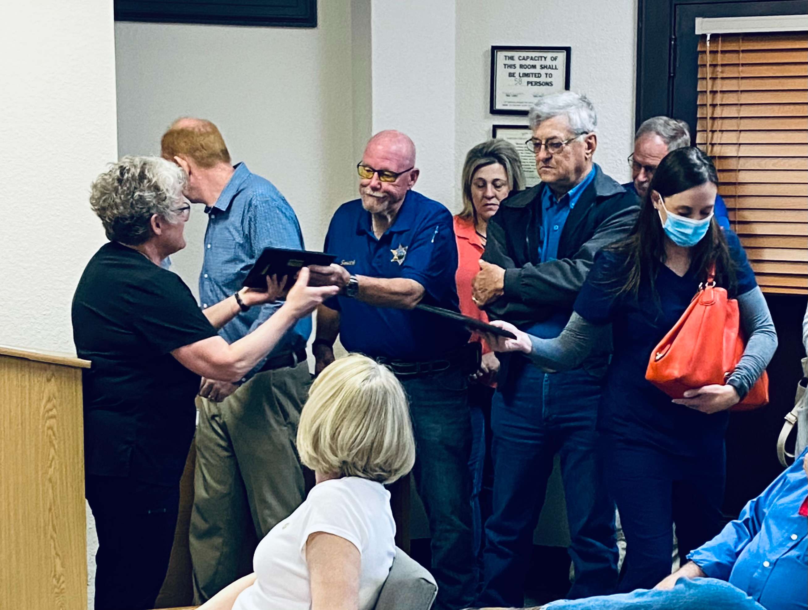 Barton County Health Director Karen Winkelman distributed awards to COVID-19 volunteers at the Barton County Commission meeting April 5, 2021.