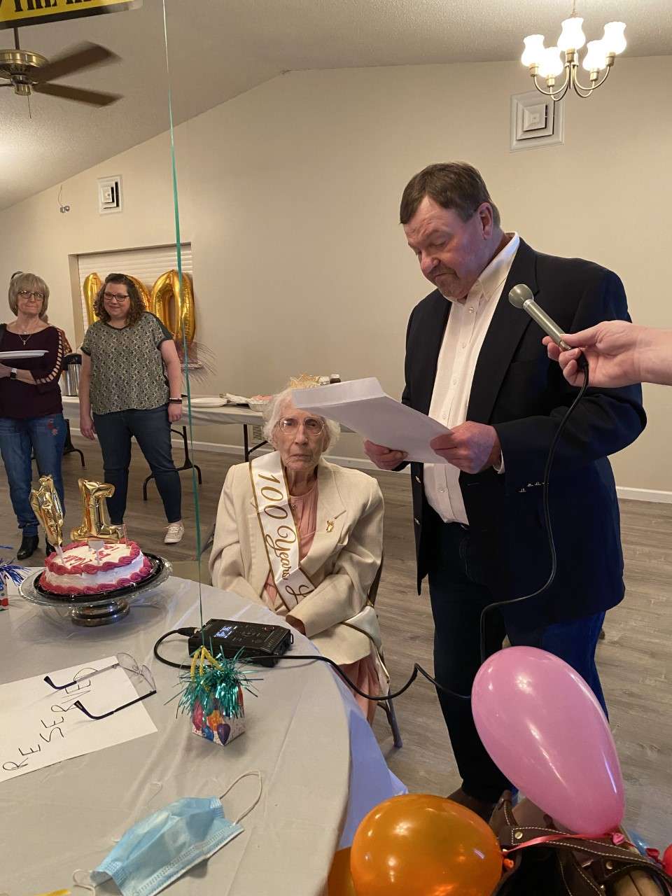 Geary County Commissioner Keith Ascher reading a proclamation honoring Nellie Smith.